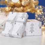 Modern Christmas Trees Silver Grey Pattern Wrapping Paper<br><div class="desc">Modern Christmas holiday season giftwrap roll featuring a pattern of modern, abstract Christmas trees and forest trees in winter snow in silver grey and white colours. ASSISTANCE: For help with design modification or personalisation, transferring the design to another product or if you would like coordinating items, contact the designer BEFORE...</div>