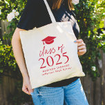 Modern Class of 2025 Red Script Graduation Tote Bag<br><div class="desc">Give the grad a personalised gift they will use! The graduation tote bag features a red graduation cap at the top of the design with "Class of 2025" displayed in bold red lettering. Personalise the red graduation tote bag with the graduate's name, school, and graduation year. The design repeats on...</div>