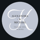Modern Classic Monogram | Dusty Blue Thank You Classic Round Sticker<br><div class="desc">These stylish wedding stickers have a dusty blue background,  and a large white calligraphy monogram.</div>