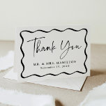 Modern Cream and Black Wavy Frame Photo Wedding Thank You Card<br><div class="desc">Thank your friends and family in style with this Modern Cream and Black Wavy Frame photo wedding thank you card! The design displays "Thank You" in a handwritten black script surrounded by a black wavy border contrasting with a light cream background. Personalise the front of the card with your name...</div>