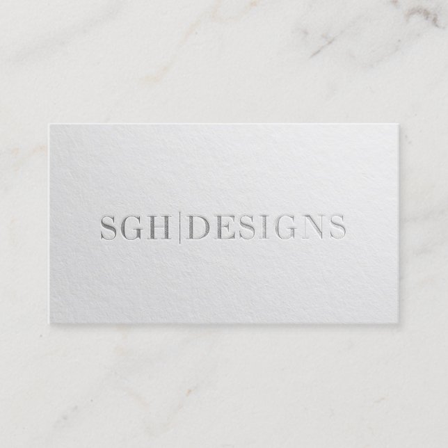 Modern Designer Minimal White Silver Embossed Text Business Card (Front)