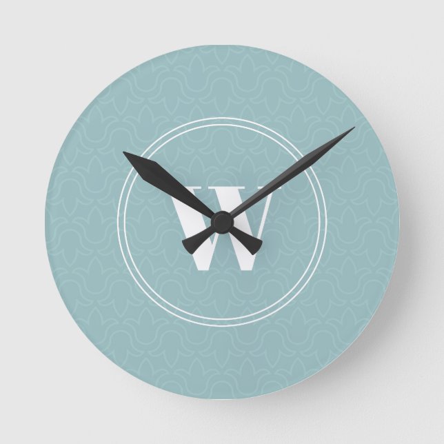 Modern discreet floral light blue simple monogram round clock (Front)