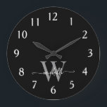 Modern Elegant Black Grey Monogram Name Script Large Clock<br><div class="desc">Girly Stylish Modern Elegant Black and Grey Monogram Initial Name Script Custom Personalised Large Clock. This design featuring a first name in a pretty hand lettered swash tail font calligraphy (or typography) with monogram initial in grey and white on black. Easy to customise it. Great stylish feminine housewarming gift, also...</div>