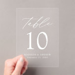 Modern Elegant White Script Acrylic Table Number<br><div class="desc">Elevate your wedding decor with our Modern Elegant White Script Acrylic Wedding Table Number Cards. These sleek, stylish cards showcase modern white lettering with 'Table' displayed in chic calligraphy script, set against a frosted or transparent acrylic background for a sophisticated, minimalist look. Personalise each card with your names, wedding date,...</div>