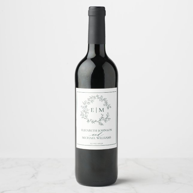 Modern Emerald Green Leafy Crest Monogram Wedding Wine Label (Front)
