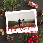 Modern Festive Red Script Merry Christmas 1 Photo  Holiday Card<br><div class="desc">This modern yet elegant holiday photo card features a single horizontal photo over a classic white background and a greeting in red script which says "Merry Christmas". This design accommodates a single horizontal photo on the front. The back of the card is a coordinating red and white stripe pattern, but...</div>