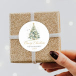 Modern Gold Script Watercolor Christmas Tree  Classic Round Sticker<br><div class="desc">Elegant,  Modern Gold Script Watercolor Christmas Tree Christmas Family Classic Round Sticker. Featuring a pretty hand lettered script Calligraphy with saying "merry christmas",  family name and year. Great for Christmas holiday season,  easy to personalise them with your names and year info.</div>