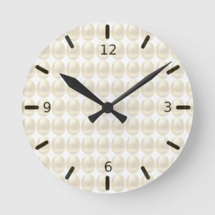 Modern golden eggs on ivory round clock