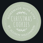 Modern Homemade Christmas Cookies Laurel Green Classic Round Sticker<br><div class="desc">Rustic and modern homemade baked goods sticker with the text homemade with love, christmas cookies and your name in stylish typography on a laurel green background. Simply add your name and the product name to the label. Exclusively designed for you by Happy Dolphin Studio. If you need any help or...</div>