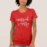 Modern Married and Merry Script Newlywed Christmas T-Shirt<br><div class="desc">Celebrate being a newlywed for your first Christmas with our cute and festive "Married and Merry" holiday t-shirt. The shirt features the phrase "Married and Merry" displayed in a handwritten white script on a red t-shirt or colour of your choice. Personalise the Married and Merry t-shirt with custom text and/or...</div>