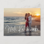 Modern Mele Kalikimaka Beach Photo Christmas Holiday Postcard<br><div class="desc">Send out holiday cheer with this modern Christmas postcard featuring a simple design with the Hawaiian greeting "Mele Kalikimaka" in an elegant thin white script,  along with your names and year over your favourite photo.  The backside has your personal message and your return address for easy mailing.</div>