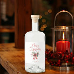Modern Merry Christmas Script Holly Bow Liquor Bottle Label<br><div class="desc">Share some Christmas holiday cheer this season with personalised Liquor Labels featuring the greeting MERRY CHRISTMAS in a modern, chic calligraphy script typography accented with a watercolor red bow and holly and your custom text (shown with name and year). ASSISTANCE: For help with design modification or personalisation, resizing, transferring the...</div>
