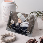 Modern Merry Christmas Script Snow Flurries Photo Holiday Card<br><div class="desc">Wish friends and family a Merry Christmas with a cute holiday photo card! The front of the card features your horizontal photo with subtle snow flurries bordering the card. "Merry Christmas" is displayed in a white, trendy calligraphy script with your family's name below. Add your custom message to the inside...</div>