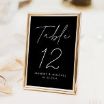 Modern Minimalist Black and White Script Wedding Table Number<br><div class="desc">Simple, modern wedding table number cards featuring "Table" displayed in a handwritten white script with a black background (or a colour of your choosing). To order the black and white table cards: add your name, wedding date, and table number. Each number needs to be added to your cart individually. After...</div>
