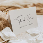 Modern Minimalist Black & White Script Thank You Card<br><div class="desc">Modern minimalist thank you cards for your wedding, engagement, bridal shower or baby shower feature "thank you" in soft black modern handwritten script lettering, with a line of custom text beneath. Personalise the inside with a custom pre-printed message; shown with "your generosity is so appreciated." This simple minimalist design in...</div>