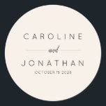 Modern Minimalist Custom Wedding Names Ivory Classic Round Sticker<br><div class="desc">Add a refined touch to your wedding favours, envelopes, or decor with these elegant minimalist personalised wedding stickers. Featuring modern typography and a clean, sophisticated design, these custom stickers are perfect for sealing invitations, favour packaging, or thank-you gifts. Personalise them with your names and wedding date for a timeless keepsake....</div>