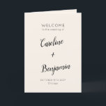 Modern Minimalist Ivory Cream Black Wedding Program<br><div class="desc">Welcome guests to your wedding day with this beautifully designed ivory cream and black folded program that combines simplicity and sophistication. The elegant cover features customisable names and event details in graceful typography, while the inside includes a preformatted template to outline your ceremony and wedding party details. The back is...</div>