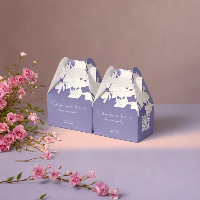 modern minimalist purple flowry favour box (Two pastel-colored gift boxes are placed on a smooth surface, accompanied by a decorative)
