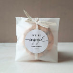 Modern Minimalist Script We're Engaged Classic Round Sticker<br><div class="desc">Modern Minimalist Script We're Engaged Classic Round Sticker</div>
