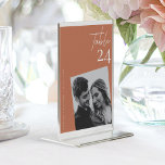 Modern Minimalist Terracotta Wedding Photo Table Number<br><div class="desc">Celebrate your special day with our enchantingModern Minimalist Terracotta Wedding Photo Table Number. This beautifully designed table number adds a touch of personalised elegance to your wedding decor, infusing the modern allure of terracotta with romantic charm. Key Features: Custom Photo: Showcase your unique love story with a personalised photo, elegantly...</div>
