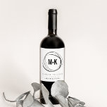 Modern Monogram Wedding Favour Wine Labels<br><div class="desc">Modern, striking and elegant wine labels are a perfect way to personalise your wine wedding favours. Chic black and white design features your initials joined in modern style by a plus sign, framed by an abstract circular border. Personalise with your custom message (shown with "cheers to love"), wedding date and...</div>