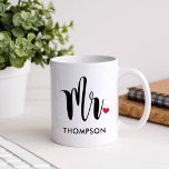 Modern Mr Calligraphy Heart Monogram Coffee Mug<br><div class="desc">This clean and stylish Mr mug features bold brush calligraphy with a sweet red heart accent and a custom last name in spaced uppercase lettering beneath. The oversized script on a crisp white background creates a modern, minimalist wedding look. The last name is fully editable for a personalised keepsake. A...</div>