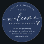 Modern Navy Blue Wedding Welcome Hotel Bag Classic Round Sticker<br><div class="desc">Navy Blue Hotel Bag Stickers: Designed in a deep navy hue, these modern handwriting wedding welcome stickers are an elegant way to greet your guests. Each 3-inch round design features “welcome friends & family” with a sweet heart accent and personalised names and date below. The rich navy background paired with...</div>