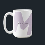 Modern Oversized Monogrammed Initial & Name Coffee Mug<br><div class="desc">Start your mornings with confidence and a custom touch with this tall lavender monogram name mug. Featuring a bold oversized initial in a soft lavender shade and a clean, minimalist name overlay, this modern design blends personality with elegance. Its tall silhouette offers more capacity for your favourite coffee, tea, or...</div>