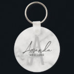 Modern Personalised Bridesmaid's Monogram and Name Key Ring<br><div class="desc">Modern Personalised Bridesmaid's Monogram and Name Gifts This design features personalised bridesmaid's name in grey modern handwriting script font style and monogram in light grey modern sans serif font style as background, with wedding details in grey modern sans serif font style, on white marble background. Also perfect for maid of...</div>