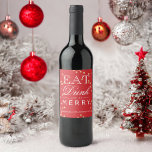 Modern red confetti typography Christmas Wine Label<br><div class="desc">A bright and original holiday or Christmas party wine label featuring the traditional red colour and faux gold glitter confetti with a "Eat drink and be merry" typography lettering.</div>