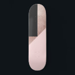 Modern Rose Gold Black Blush Pink Geometric Skateboard<br><div class="desc">This elegant and chic pattern is perfect for the modern woman. It features a faux printed rose gold foil, black, and blush pink color block triangle geometric pattern. It's stylish, trendy, unique, and fashionable! ***IMPORTANT DESIGN NOTE: For custom requests relating to changes of design aspects; including color swaps or matching...</div>