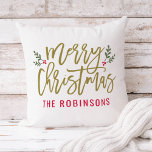 Modern Script Merry Christmas Gold Monogram Cushion<br><div class="desc">Seasonal pillow design features a modern antique gold script "Merry Christmas" with red custom text that can be personalised with your last name. Green branches of holly leaves and red berries accent the design.</div>