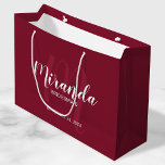 Modern Script Personalised Bridesmaid Burgundy Red Large Gift Bag<br><div class="desc">Personalised Bridesmaids Gift Bag featuring personalised bridesmaid's name in white modern script font style and monogram in light burgundy red modern script font style as background with title and wedding date in white modern sans serif font style on burgundy red background. Also perfect for groomsman, best man, ring bearer, father...</div>