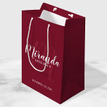 Modern Script Personalised Bridesmaid Burgundy Red Medium Gift Bag<br><div class="desc">Personalised Bridesmaids Gift Bag featuring personalised bridesmaid's name in white modern script font style and monogram in light burgundy red modern script font style as background with title and wedding date in white modern sans serif font style on burgundy red background. Also perfect for groomsman, best man, ring bearer, father...</div>