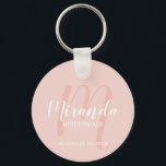Modern Script Personalised Bridesmaid Key Ring<br><div class="desc">Add a personal touch to your wedding with personalised bridesmaid keychain. This keychain features personalised bridesmaid's name in white modern script font style and monogram in blush pink modern script font style as background with title and wedding date in white modern sans serif font style on blush pink background. Also...</div>