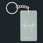 Modern Script Personalised Bridesmaid Key Ring<br><div class="desc">Add a personal touch to your wedding with personalised bridesmaid keychain. This keychain features personalised bridesmaid's name in white modern script font style and monogram in sage green modern script font style as background with title and wedding date in white modern sans serif font style on sage green background. Also...</div>