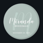 Modern Script Personalised Bridesmaid Magnet<br><div class="desc">Add a personal touch to your wedding with personalised bridesmaid magnet. This magnet features personalised bridesmaid's name in white modern script font style and monogram in sage green modern script font style as background with title and wedding date in white modern sans serif font style on sage green background. Also...</div>