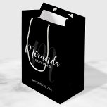 Modern Script Personalised Bridesmaids Black Medium Gift Bag<br><div class="desc">Personalised Bridesmaids Gift Bag featuring personalised bridesmaid's name in white modern script font style and monogram in grey modern script font style as background with title and wedding date in white modern sans serif font style on black background. Also perfect for groomsman, best man, ring bearer, father of the bride,...</div>