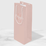 Modern Script Personalised Bridesmaids Wine Gift Bag<br><div class="desc">Personalised Bridesmaids Gift Bag featuring personalised bridesmaid's name in white modern script font style and monogram in blush pink modern script font style as background with title and wedding date in white modern sans serif font style on blush pink background. Also perfect for maid of honour, flower girl, mother of...</div>