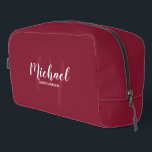 Modern Script Personalised Groomsman Monogram Name Dopp Kit<br><div class="desc">Add a personal touch to your wedding with personalised groomsman gift. This design features personalised groomsman's name in white modern script font style and monogram in light burgundy red modern script font style as background with title in white modern sans serif font style on burgundy red background. Also perfect for...</div>