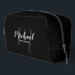 Modern Script Personalised Groomsman Monogram Name Dopp Kit<br><div class="desc">Add a personal touch to your wedding with personalised groomsman gift. This design features personalised groomsman's name in white modern script font style and monogram in light grey modern script font style as background with title in white modern sans serif font style on black background. Also perfect for maid of...</div>