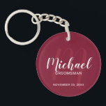 Modern Script Personalised Groomsmen Monogram&Name Key Ring<br><div class="desc">Add a personal touch to your wedding with personalised groomsmen keychain. This keychain features personalised groomsmen's name in white modern script font style and monogram in light burgundy red modern script font style as background with title and wedding date in white modern sans serif font style on burgundy red background....</div>