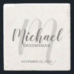 Modern Script Personalised Groomsmen Stone Coaster<br><div class="desc">Add a personal touch to your wedding with personalised groomsmen stone coaster. This coaster features personalised groomsmen's name in grey modern script font style and monogram in light grey modern script font style as background with title and wedding date in grey modern sans serif font style. Also perfect for best...</div>