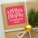 Modern Script Red Merry Christmas Custom Square Sticker<br><div class="desc">Stylish Merry Christmas holiday favour sticker features white script writing and accents of branches with holly leaves and berries. Personalise with custom name / family and year text. The crimson red background colour can be modified.</div>