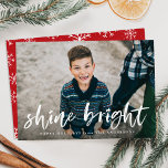 Modern Shine Bright Script Red Photo Holiday Card<br><div class="desc">Wish friends and family a happy holiday season with our trendy and modern Shine Bright holiday greeting card. The cute holiday card displays your photo on the front with "Shine Bright" in a white, painted brush script overlay with a short greeting and your name below. The back of the card...</div>