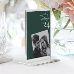 Modern Stylish Emerald Green wedding photo Table Number<br><div class="desc">Elevate your wedding decor with our Modern Stylish Emerald Green wedding photo Table Number . This exquisite table number captures the essence of sophistication and elegance, adding a touch of regal charm to your special day. The captivating emerald green background sets the stage for a modern and stylish design that...</div>