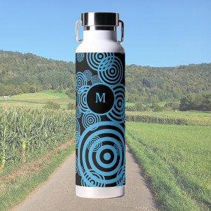 Modern, trendy blue circles on black monogram  water bottle