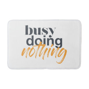 Modern, trendy, urban design of Busy Doing Nothing Bath Mat