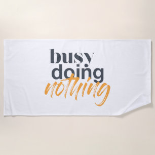 Modern, trendy, urban design of Busy Doing Nothing Beach Towel