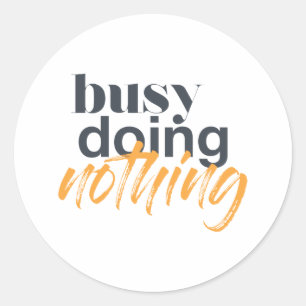Modern, trendy, urban design of Busy Doing Nothing Classic Round Sticker
